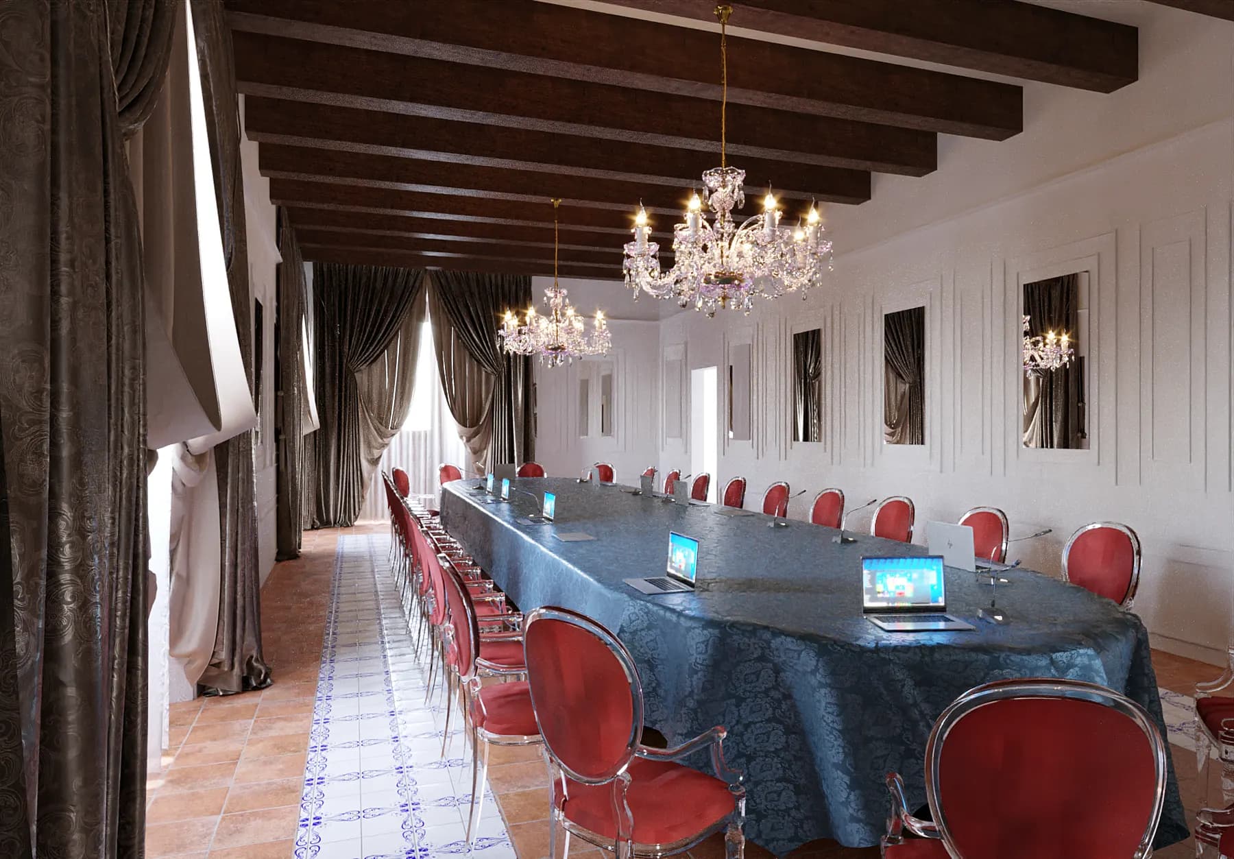 Salone con travi a vista, lampadari in cristallo e tavolo lungo apparecchiato per riunioni